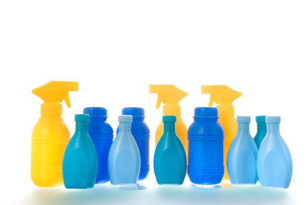 Yellow and blue plastic bottles isolated over white backgroundの写真素材