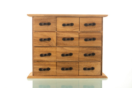 Wooden chest of drawers isolated over white background