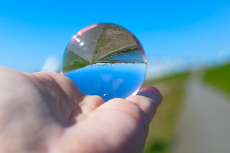 storm surge barrier in river upside down in glass ballの写真素材