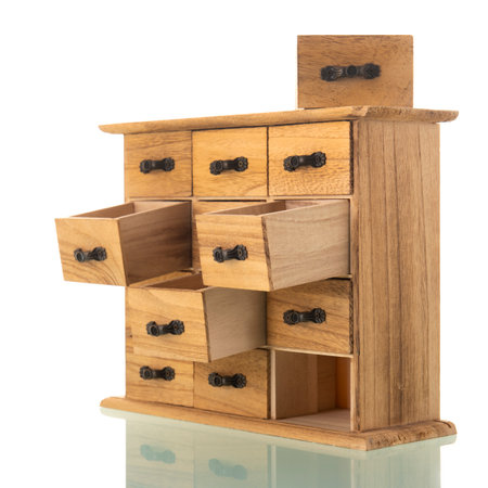 Wooden chest of drawers isolated over white backgroundの写真素材