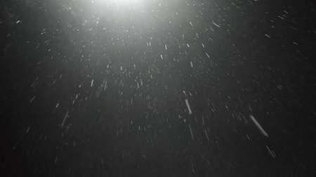 heavy rain in the night. View on rain under street light. Blurre and highlights.の写真素材