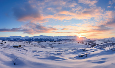 Beautiful winter landscape in the mountains. Sunset over the valley.の素材