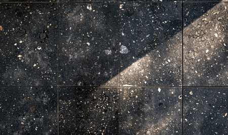 top-view flat background composed of sleek black granite tilesの素材