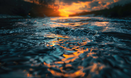 Closeup view on sea water surface with small waves and sun light on itの素材