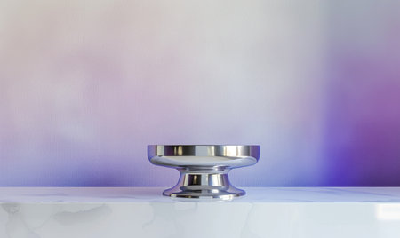 A polished chrome pedestal on a glossy white table against a subtle gradient of lavender and lilac backdropの素材