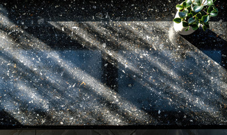 Top view of a black granite countertop, neutral backgroundの素材