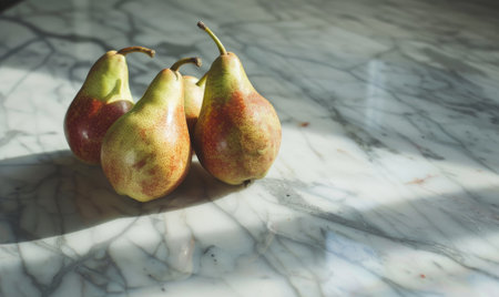 Close-up of pears on a marble countertopの素材