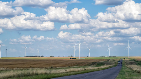windmills in summer afternoon with clouds