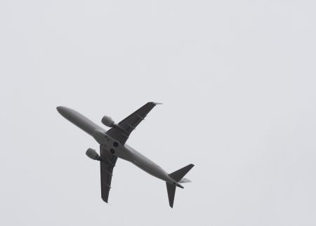Airplane right before take off on white backgroundの写真素材