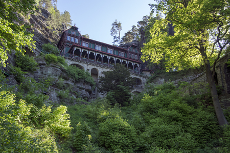 Pravcicka brana is a narrow rock formation located in Bohemian Switzerland, late spring scenery with greenery, blue sky and sunlight, natural monumentの写真素材