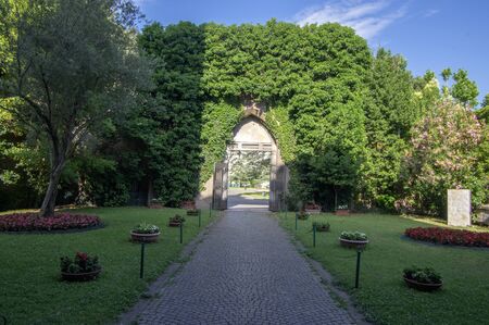 Ravenna / ITALY - June 20, 2018: Church of San Giovanni Evangelista, beautiful church with green gate, blue sky.のeditorial素材