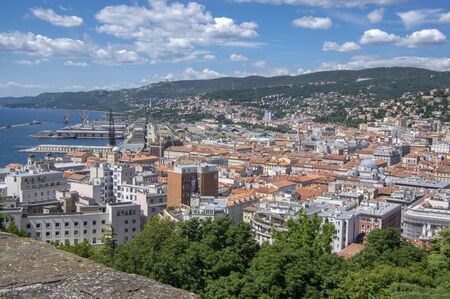 Trieste / Italy - June 23,2018: Amazing aerial view to Italian Trieste city. Group of buildings view...