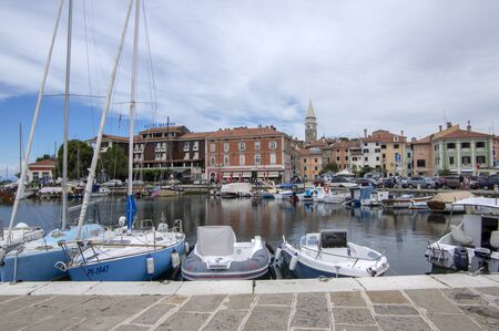 Izola / SLOVENIA - June 25, 2018: Marina with many boats. Summer scenery with sunlight and blue sky. Great place for vacation. Famous port with hotel Marina.のeditorial素材