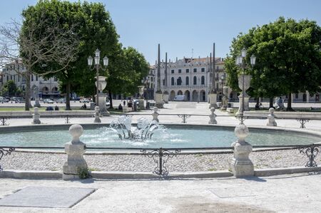Padua / ITALY - June 12, 2017: Beautiful summer day on Prato della Valle square with water canal. Amazing white italian sculptures. Greenery, blue sky and sunlight.のeditorial素材