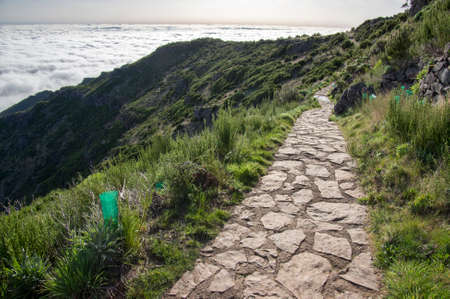 Pico Ruivo hiking, above clouds, amazing magic landscape, incredible views, sunny weather with low clouds, island Madeira, Portugalの写真素材