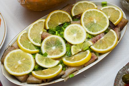Herring with lemon on the festive christmas dinnerの写真素材