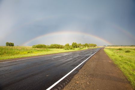 Road to the rainbow. After thunderstorm, Novosibirsk area, June 2007の写真素材