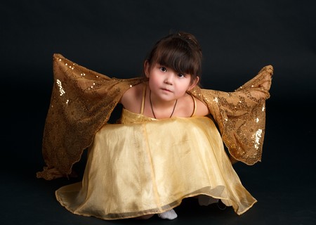 Little fashion model posin in studio.の写真素材