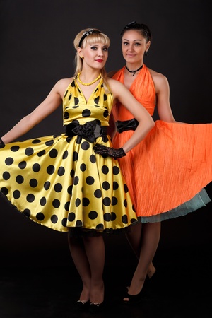Young dancer women in retro dresses の写真素材