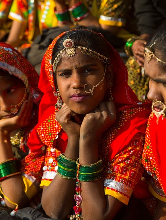 Rajasthan, India, November-21, 2012  Traditional Indian women in a rural costume looking for the camera at Pushkar camel fair, Rajasthan, Indiaのeditorial素材