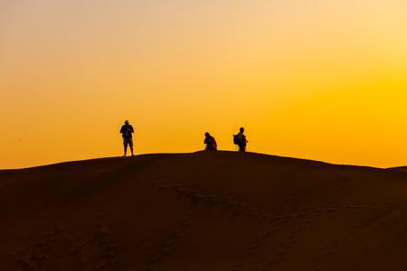 Sunset Photographers in the Desertの写真素材