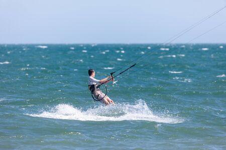 Kitesurfing or Kiteboarding