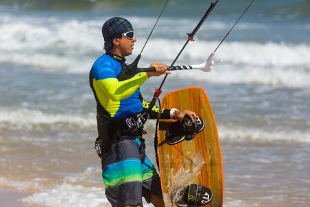Kitesurfing at sunset photo