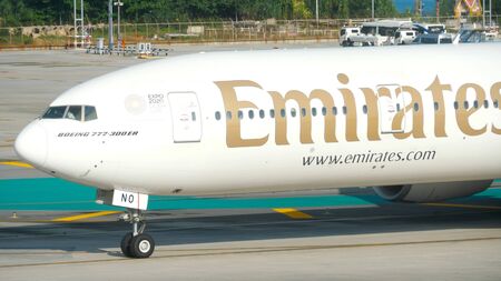Emirates taxiing at Phuket airportのeditorial素材