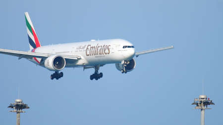Emirates Boeing 777 approaching over oceanのeditorial素材