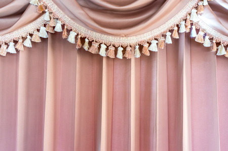 Patterned pink and lace curtainsの写真素材