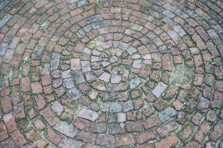 Old Red Brick Road Surface Shaped in a Circleの写真素材