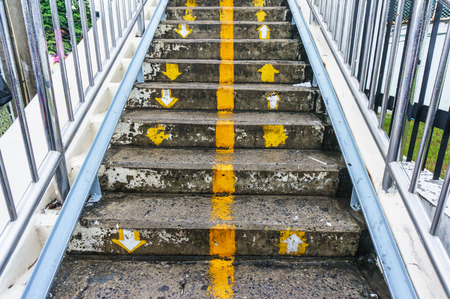 Old metal stairs of the overpass in the city