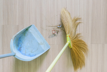 top view of a broomand Dustpan old withdust in living room,select focusの写真素材