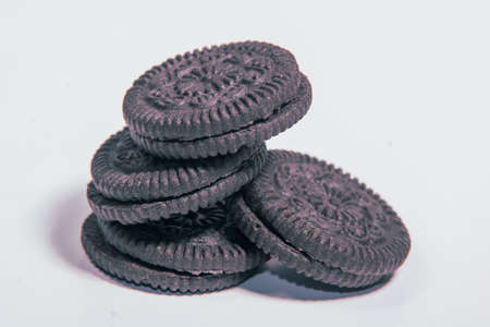 Chocolate cookies on a white background. Selective focus. Toned.