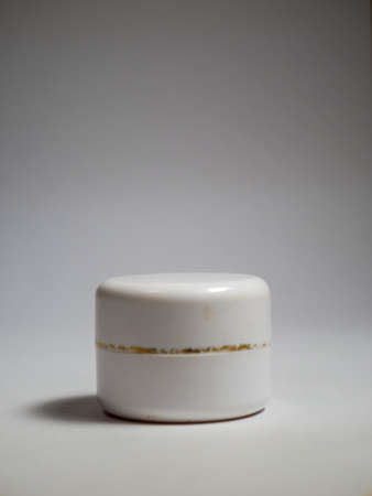 Cosmetic cream jar on a white background. Skin care product.