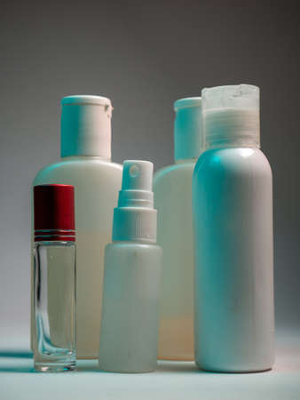 Cosmetic bottles on a gray background. Shampoo, gel, lotion, creamの写真素材