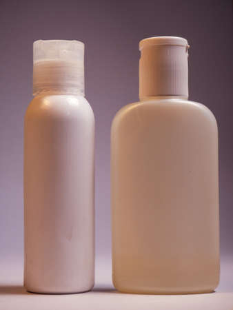 Cosmetic bottles on a gray background. Cosmetics for face and body care.の写真素材