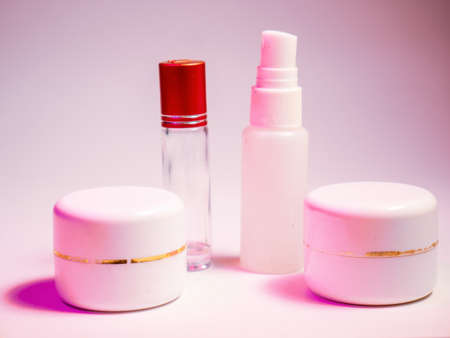 Cosmetic bottles on pink background. Beauty, skin care concept.の写真素材