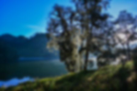 Blurred view of lake ranu kumbolo, semeru mountain. bokeh background in summer, green nature conceptの写真素材