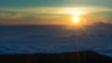 Blurred landscape blue sky with clouds, beautiful fantasy pastel colorful landscape background, gradient sky, sunrise with mountains in distantの写真素材