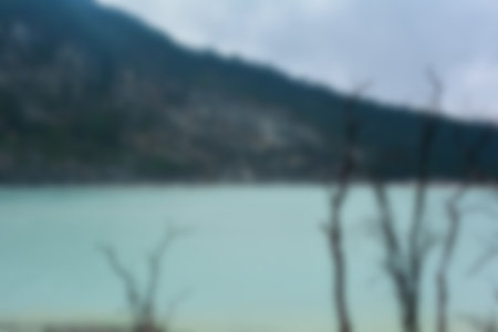 Blurred view of Kawah Putih (white crater), a hot volcanic lake. Tourist destination in South of Bandung, West Java, Indonesia.の写真素材