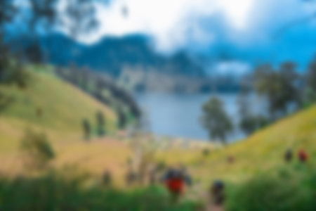 Blurred view of lake ranu kumbolo, semeru mountain. bokeh background in summer, green nature conceptの写真素材