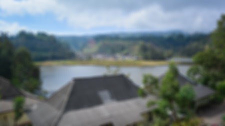 Blurred view of lake ranu kumbolo, semeru mountain. bokeh background in summer, green nature conceptの写真素材