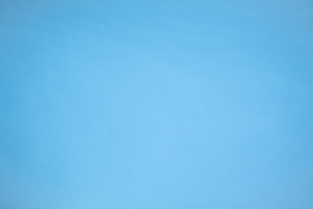 Blue sky background with tiny clouds. Abstract background for modern design.の写真素材