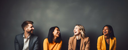 Group of happy multiethnic business people looking at camera and laughingの素材