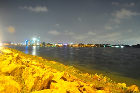 Lower seletar reservoir near Yishun Dam, north of Singapore with rocks on its edge at nightの素材 [FY31045148301]