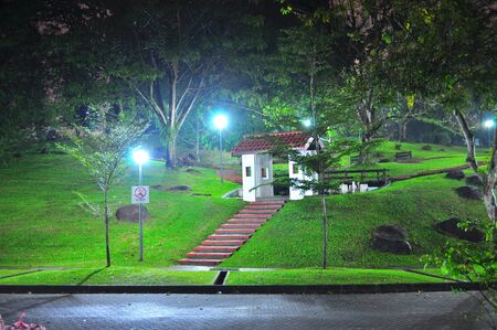 Yishun Neighbourhood Park, a park by road junction with small hill, located in the north of Singapore, by nightの写真素材