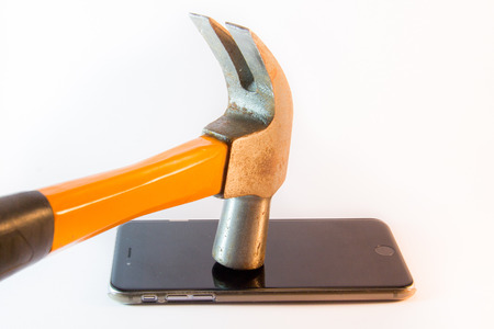Hammer on mobile phoneの写真素材