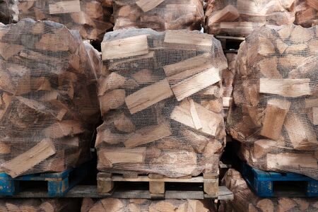 Palettes with packages of firewood