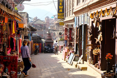 Bhaktapur, Nepal - circa November 2019: Narrow street with small shops and souvenir stalls in Bhaktapur,, Kathmandu Valley, Nepal, Asiaのeditorial素材